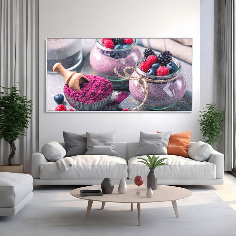 Tablou canvas cu natura moarta cu desert si fructe de padure, in rama de aluminiu argintiu, pe perete intr-un living
